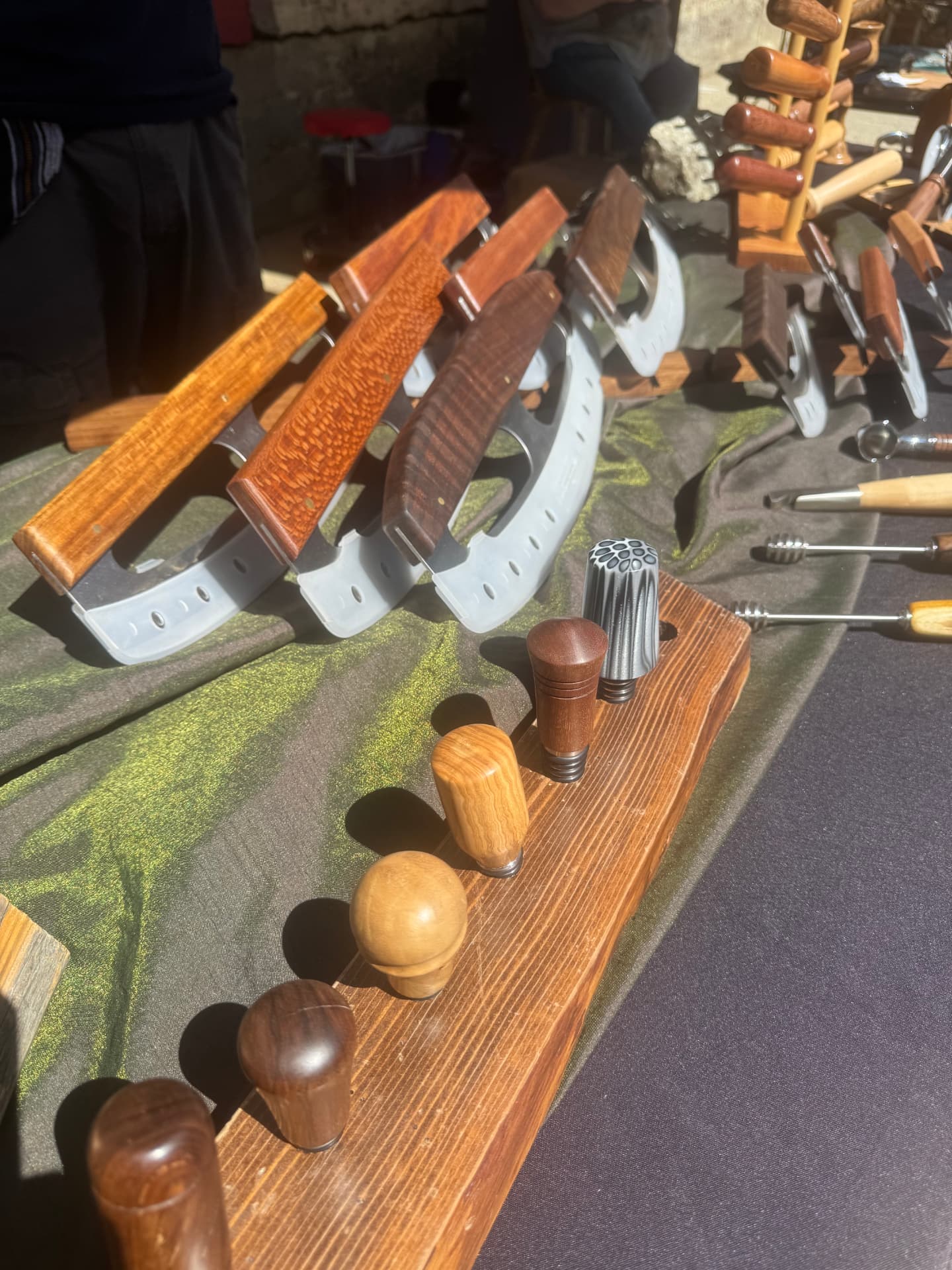 Hand-turned wooden tool handles and drawknives from a Sierra Foothills maker.