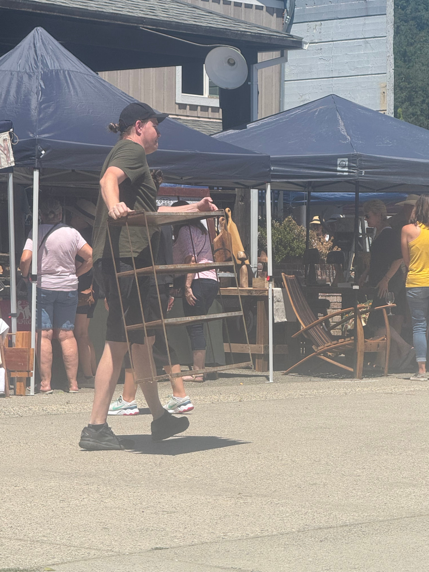 Shoppers strolling past vendor tents at the Colfax Bazaar in the Sierra Foothills.