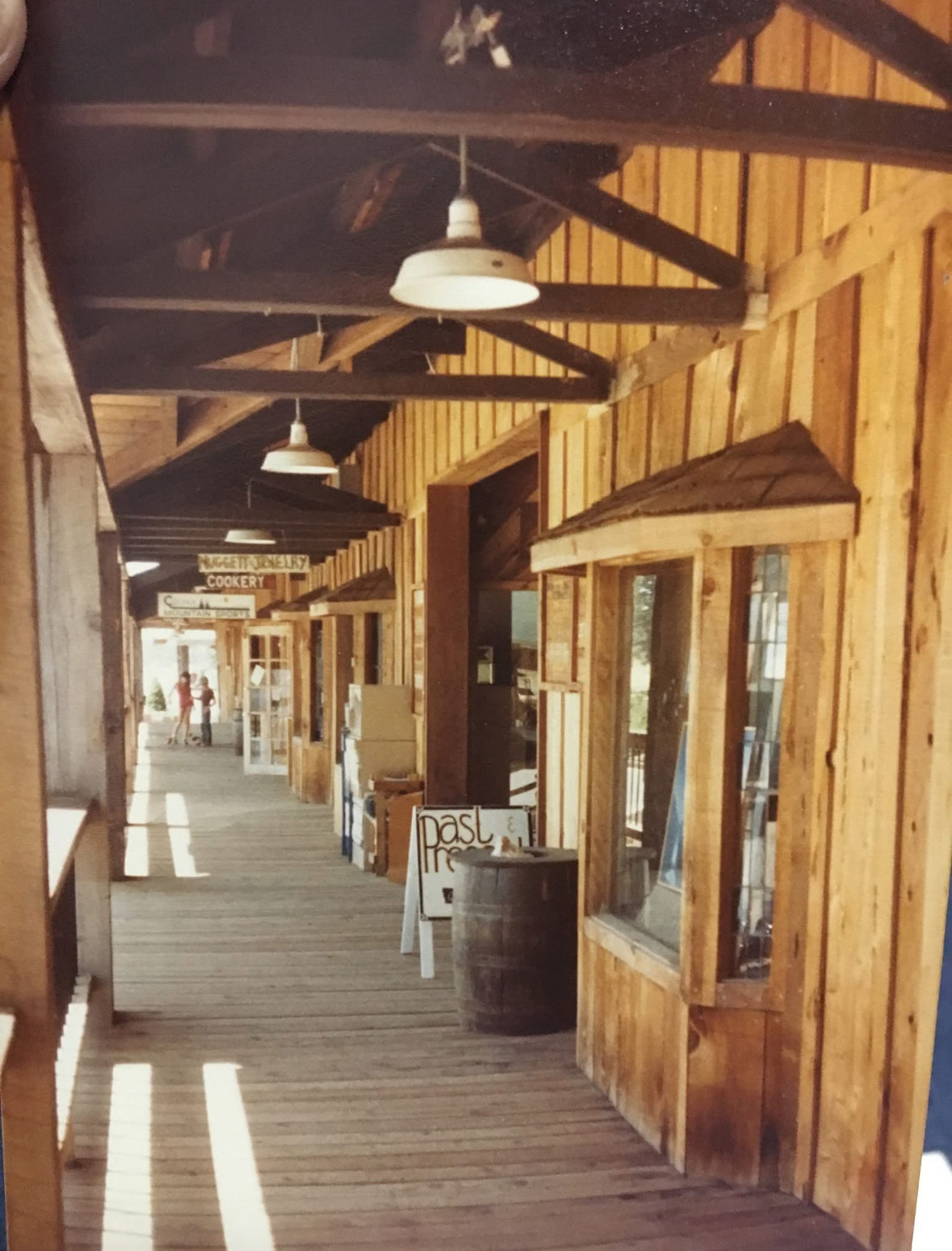 The covered wooden boardwalk of shops at the Historic Fruit Exchange Building.
